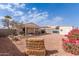 Landscaped backyard with gravel and covered patio at 2177 S Weaver Dr, Apache Junction, AZ 85120