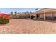 View of the backyard with gravel, shade covering and plants at 2177 S Weaver Dr, Apache Junction, AZ 85120