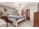 Cozy bedroom featuring a queen-sized bed and a ceiling fan at 2177 S Weaver Dr, Apache Junction, AZ 85120