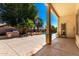 Beautiful covered patio overlooking a sparkling pool and built-in BBQ area in this home's lush backyard at 22139 N 80Th Ln, Peoria, AZ 85383