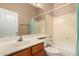 Bright bathroom featuring a vanity, sink, mirror, and tub at 22139 N 80Th Ln, Peoria, AZ 85383