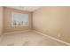 Bedroom featuring carpet, a window, and neutral paint at 22139 N 80Th Ln, Peoria, AZ 85383