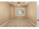 Bedroom featuring carpet, window, and neutral paint at 22139 N 80Th Ln, Peoria, AZ 85383