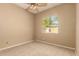 Cozy bedroom with carpet, a ceiling fan, and natural light at 22139 N 80Th Ln, Peoria, AZ 85383