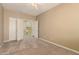 Bedroom features an open door to a laundry room at 22139 N 80Th Ln, Peoria, AZ 85383