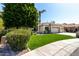 Landscaped front yard showing a large tree and sidewalk leading up to the home at 22139 N 80Th Ln, Peoria, AZ 85383