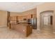 Large kitchen with an island, stainless steel appliances, and light wood cabinets at 22139 N 80Th Ln, Peoria, AZ 85383