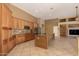 Kitchen with island, stainless appliances and cabinets with stone countertops and backsplash at 22139 N 80Th Ln, Peoria, AZ 85383