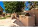 Outdoor kitchen with a fireplace and stainless steel BBQ for outdoor entertaining at 22139 N 80Th Ln, Peoria, AZ 85383