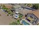 Birds-eye view of a property showing the backyard spa, patio area, and mature trees at 22346 N Goles Dr, Maricopa, AZ 85138