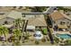 Aerial view of a home featuring a spa, covered patio, and lush landscaping at 22346 N Goles Dr, Maricopa, AZ 85138