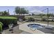 Landscaped backyard showcasing a spa and well-maintained greenery at 22346 N Goles Dr, Maricopa, AZ 85138