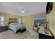 Comfortable bedroom featuring neutral tones, a ceiling fan, and a window with blinds at 22346 N Goles Dr, Maricopa, AZ 85138