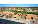 Wide aerial view of a large community featuring well-maintained homes and a golf course at 2415 Leisure World --, Mesa, AZ 85206