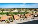 Bird's-eye view of a desert community with a golf course and mountains in the distance at 2415 Leisure World --, Mesa, AZ 85206