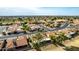 Aerial view captures a well-planned neighborhood with lush green golf course in the background at 2415 Leisure World --, Mesa, AZ 85206