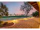 Backyard patio view with desert landscaping and expansive golf course and sunset views at 2415 Leisure World --, Mesa, AZ 85206