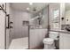 Bathroom showcasing tiled shower with glass enclosure, patterned accent tile, and white toilet at 2415 Leisure World --, Mesa, AZ 85206