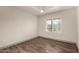 Neutral bedroom showcasing a window with shutter and plank flooring at 2415 Leisure World --, Mesa, AZ 85206