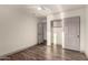 A light and airy bedroom with wood look tile flooring, a fan and closet at 2415 Leisure World --, Mesa, AZ 85206