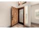 Light and bright entryway with an ornate stained-glass window and wood-look flooring at 2415 Leisure World --, Mesa, AZ 85206