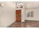 Light and bright entryway featuring an ornate wood front door and wood-look flooring at 2415 Leisure World --, Mesa, AZ 85206