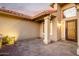 Close up view of the front door, featuring desert landscaping, and stone pavers at 2415 Leisure World --, Mesa, AZ 85206