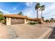 Beautiful single-story home featuring a desert landscape, tile roof, and an attached two-car garage at 2415 Leisure World --, Mesa, AZ 85206