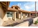 Exterior tan home with fountain, stone walkway, tile roof and decorative columns at 2415 Leisure World --, Mesa, AZ 85206