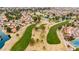 Aerial view showcasing a well-manicured golf course winding through a residential community at 2415 Leisure World --, Mesa, AZ 85206