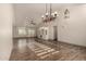 Bright living room boasting wood-look tile flooring and a built-in entertainment center at 2415 Leisure World --, Mesa, AZ 85206