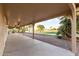 Covered patio with ceiling fans and desert landscaping overlooking the golf course at 2415 Leisure World --, Mesa, AZ 85206