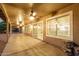 Long covered patio with multiple ceiling fans at 2415 Leisure World --, Mesa, AZ 85206