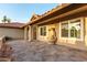 Covered patio with water feature, travertine flooring, and neutral stucco at 2415 Leisure World --, Mesa, AZ 85206