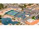 Aerial photo showing tennis and pickleball courts near a community pond at 2415 Leisure World --, Mesa, AZ 85206