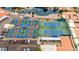 Aerial view of tennis and pickleball courts near a parking lot and pond with water features at 2415 Leisure World --, Mesa, AZ 85206