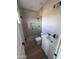 Bathroom with glass enclosed shower, modern fixtures, and a sleek vanity with sink at 24184 E King Rd, Florence, AZ 85132