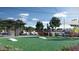 Community park featuring barbecue area, picnic tables, cornhole boards and a playground for outdoor enjoyment at 2430 W Hidalgo Ave, Phoenix, AZ 85041