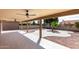 Covered back patio with tiled floors and nice landscaping at 25620 S Cloverland Dr, Sun Lakes, AZ 85248