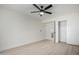 Spacious bedroom featuring wood-look floors and a closet with sliding doors at 25620 S Cloverland Dr, Sun Lakes, AZ 85248