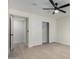 Bright bedroom with a ceiling fan, closet and modern light wood flooring at 25620 S Cloverland Dr, Sun Lakes, AZ 85248