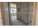 Unfinished bathroom featuring bare drywall, with visible plumbing fixtures, water lines, and drain pipe at 2706 E Abe Truckle Ave, San Tan Valley, AZ 85140