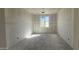 Unfinished room featuring bare drywall, with visible taped seams, one window allowing natural light at 2706 E Abe Truckle Ave, San Tan Valley, AZ 85140