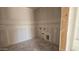 Unfinished laundry room featuring bare drywall, with visible plumbing fixtures and drain pipe at 2706 E Abe Truckle Ave, San Tan Valley, AZ 85140