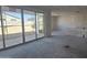 Unfinished living room featuring sliding glass doors offering abundant natural light ready for customization at 2706 E Abe Truckle Ave, San Tan Valley, AZ 85140