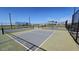 Close-up of community pickleball courts with net, providing a recreational amenity for residents at 2706 E Abe Truckle Ave, San Tan Valley, AZ 85140