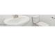 Bathroom featuring a pedestal sink and modern toilet at 2707 E Abe Truckle Ave, San Tan Valley, AZ 85140