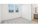 Bright bedroom with two windows, neutral carpet, and a view of the street at 2707 E Abe Truckle Ave, San Tan Valley, AZ 85140