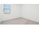 Bedroom with neutral carpet, white walls, and one window at 2707 E Abe Truckle Ave, San Tan Valley, AZ 85140
