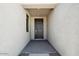 Welcoming front entrance with a dark wood door and textured walls for added curb appeal at 2707 E Abe Truckle Ave, San Tan Valley, AZ 85140